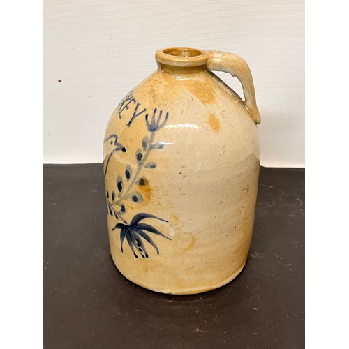 147 - Stoneware Whiskey flagon decorated with a bird in a floral composition.

15 cm high overall.

This l... 