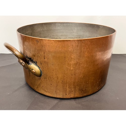 149 - Large two handled arts and crafts copper pan with a finely planished finish, 36 cm in diameter 20 cm... 