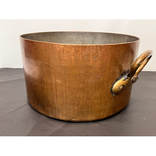 149 - Large two handled arts and crafts copper pan with a finely planished finish, 36 cm in diameter 20 cm... 