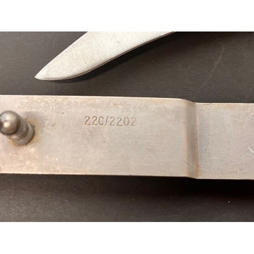 148 - Militaria, a metal sheathed British escape knife for RAF aircrew and Army parachutists.

This lot is... 