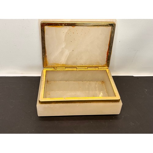 191 - Onyx cigarette box 14 cm x 10 cm and a bottle opener with a vine root handle.

This lot is available... 