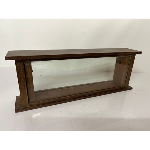 289 - Oak framed display cabinet 21 inches long x 7.5 high

This lot is available for in-house shipping