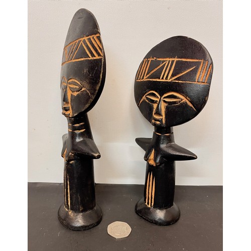 22 - Two West African carved tribal art fertility figures.

This lot is available for in-house shipping