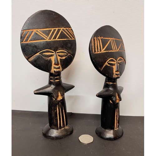 22 - Two West African carved tribal art fertility figures.

This lot is available for in-house shipping