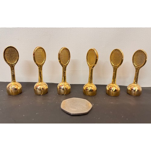 23 - Set of six Tennis themed place markers in the form of rackets rising from a ball base section, boxed... 