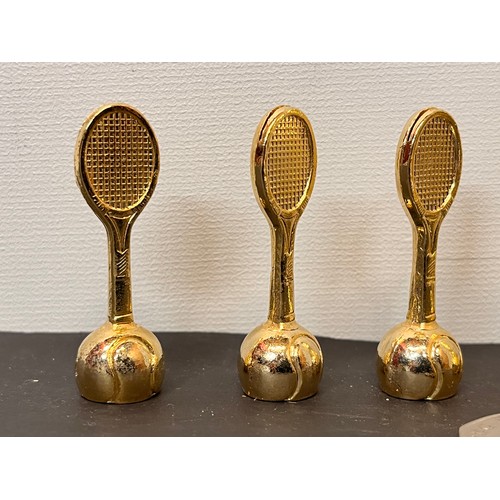 23 - Set of six Tennis themed place markers in the form of rackets rising from a ball base section, boxed... 