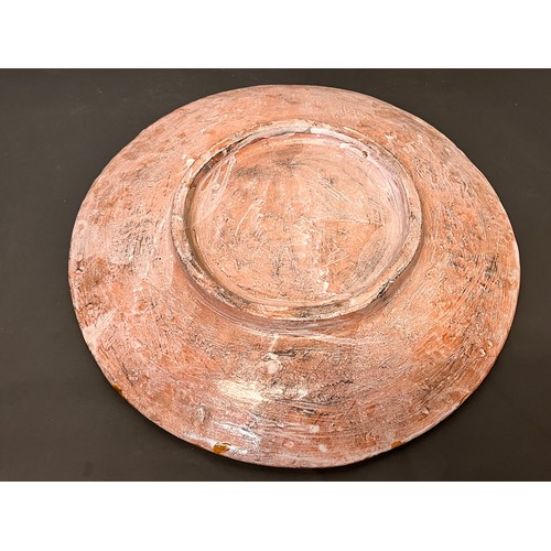 24 - Kitchenalia, a large art pottery serving platter for Oysters, 40 cm in diameter.

This lot is availa... 