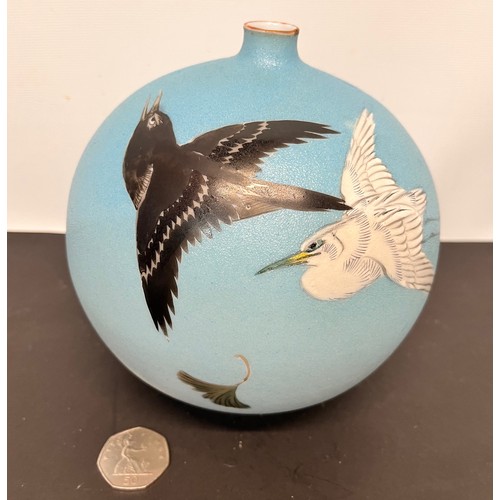 40 - Oriental globe form footed vase decorated with birds.

This lot is available for in-house shipping