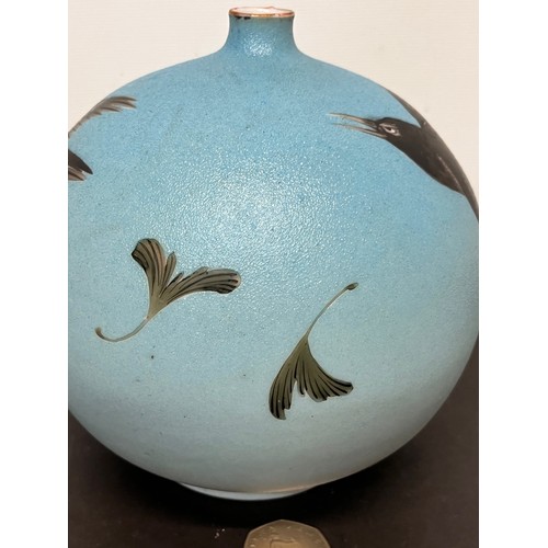 40 - Oriental globe form footed vase decorated with birds.

This lot is available for in-house shipping