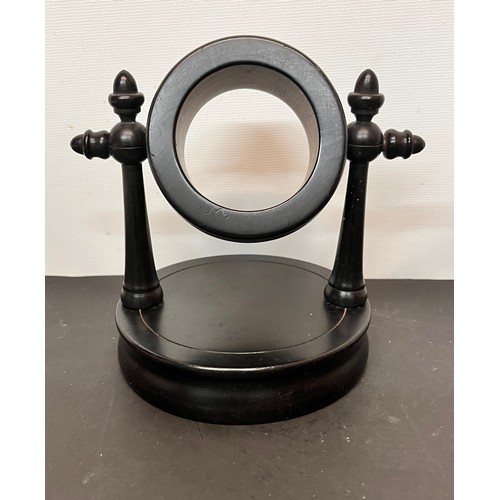 50 - Treen pocket watch stand marked Real Ebony to the base.

This lot is available for in-house shipping