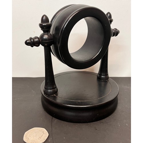 50 - Treen pocket watch stand marked Real Ebony to the base.

This lot is available for in-house shipping