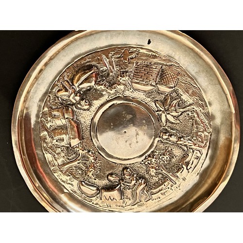 54 - Embossed and plated dish decorated with Indian scenes.

This lot is available for in-house shipping