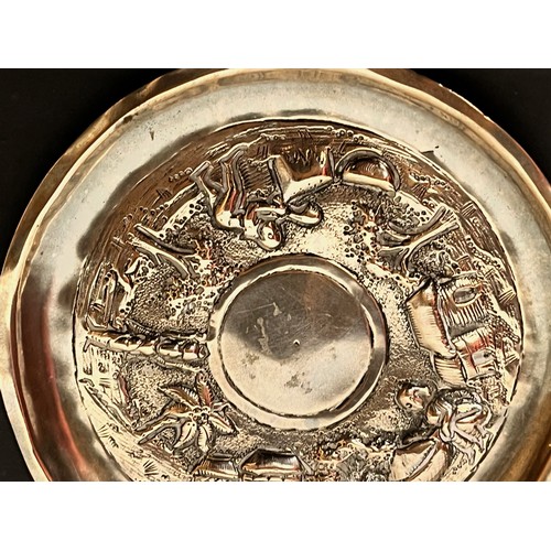 54 - Embossed and plated dish decorated with Indian scenes.

This lot is available for in-house shipping