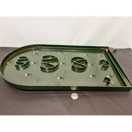 93 - Toys and Games, vintage green Bakelite bagatelle game 63 cm long.

This lot is available for in-hous... 