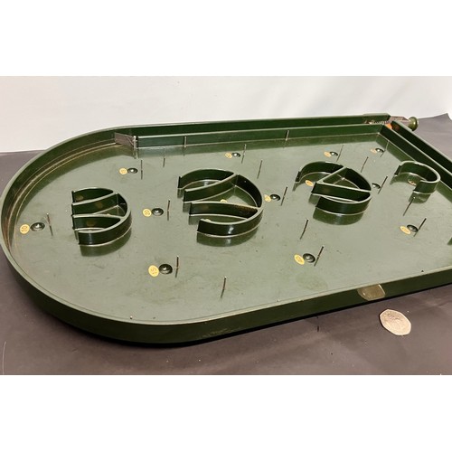 93 - Toys and Games, vintage green Bakelite bagatelle game 63 cm long.

This lot is available for in-hous... 