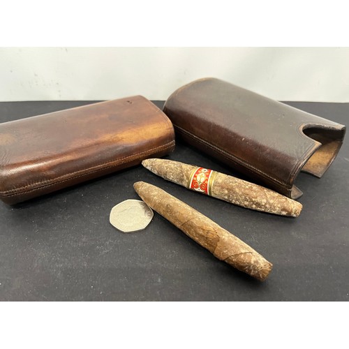 44 - Leather cigar case with a couple of residents included. 5 inches long when fully closed.

This lot i... 