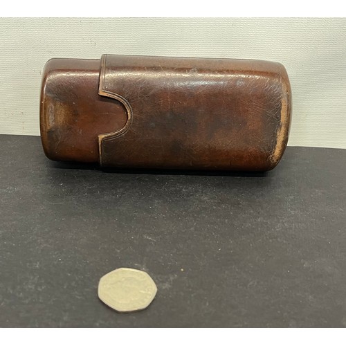 44 - Leather cigar case with a couple of residents included. 5 inches long when fully closed.

This lot i... 