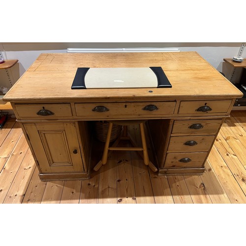 203 - Classic pine office furniture, a generous three section knee hole desk, multiple drawer sections and... 