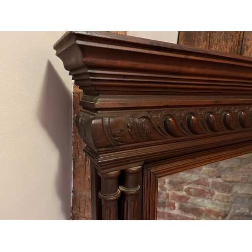 208 - Large decorative mahogany framed bevel edged over mantle mirror. 118 cm high x 91 cm wide.

Collecti... 