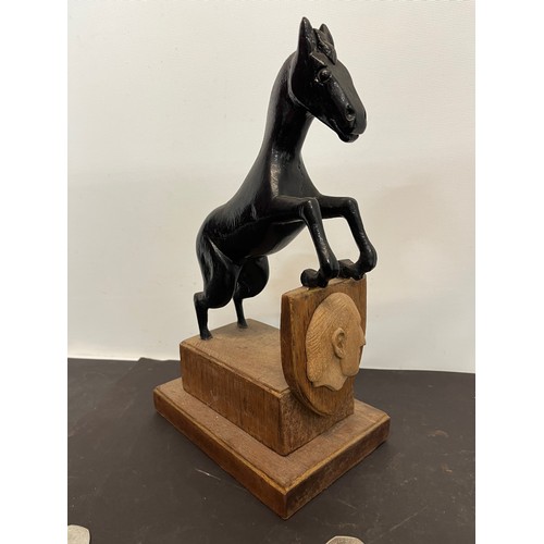 222 - Wooden horse figure on stand. 20 cm high overall.

This lot is available for in-house shipping