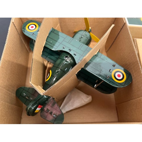 43 - Tin plate toy Bugatti racing car and a Curtis WWI era fighter, bothe boxed.

This lot is available f... 