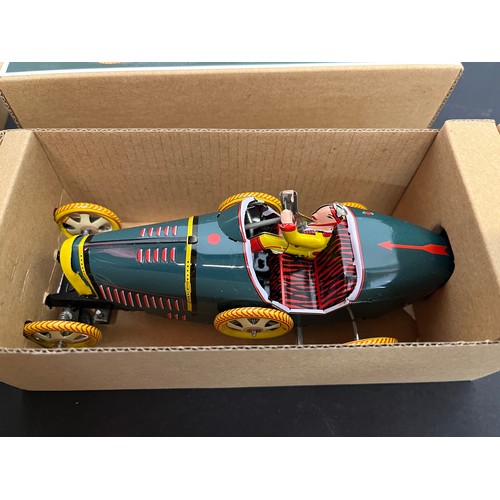 43 - Tin plate toy Bugatti racing car and a Curtis WWI era fighter, bothe boxed.

This lot is available f... 