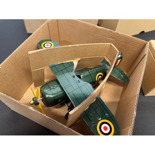 43 - Tin plate toy Bugatti racing car and a Curtis WWI era fighter, bothe boxed.

This lot is available f... 