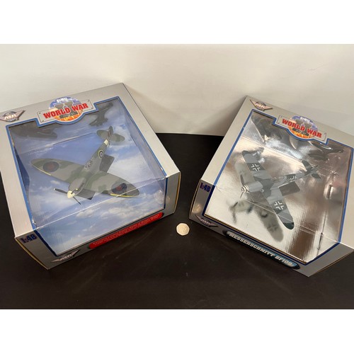 46 - Die cast toys, two models of British and German forces WWII fighter aircraft,.

This lot is availabl... 