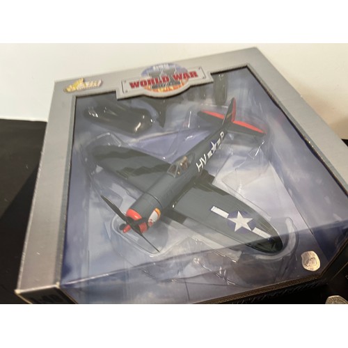 48 - Die cast toys, two models of US forces WWII fighter aircraft,.

This lot is available for in-house s... 