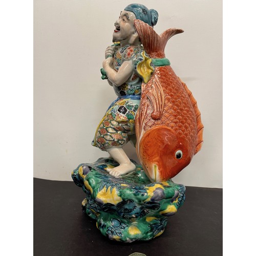 7 - Ceramic figurine of Ebisu the Japanese God of Fishing 31 cm tall.

This lot is available for in-hous... 