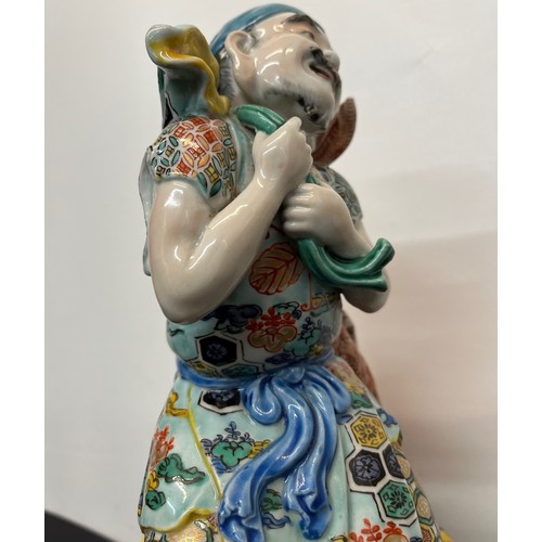 7 - Ceramic figurine of Ebisu the Japanese God of Fishing 31 cm tall.

This lot is available for in-hous... 