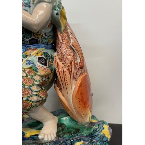 7 - Ceramic figurine of Ebisu the Japanese God of Fishing 31 cm tall.

This lot is available for in-hous... 