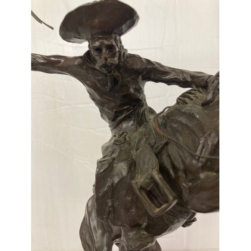 69 - C20th American Remington Cowboy sculpture in bronze. A study after Frederic Remington titled Bronco ... 