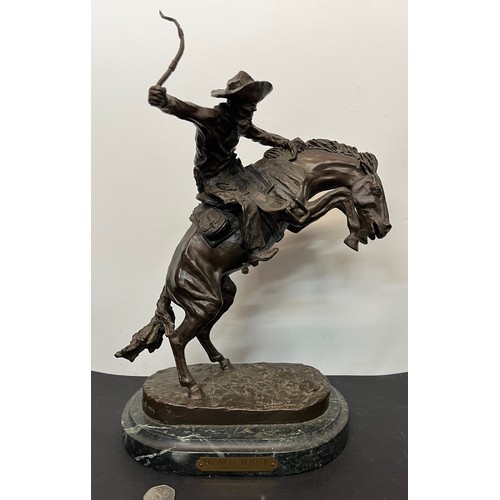 69 - C20th American Remington Cowboy sculpture in bronze. A study after Frederic Remington titled Bronco ... 