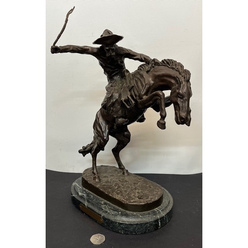 69 - C20th American Remington Cowboy sculpture in bronze. A study after Frederic Remington titled Bronco ... 