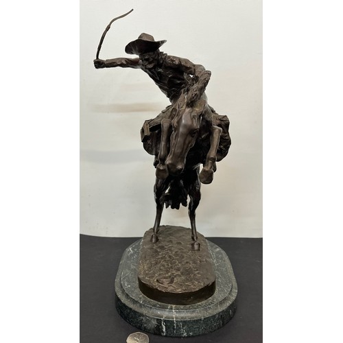 69 - C20th American Remington Cowboy sculpture in bronze. A study after Frederic Remington titled Bronco ... 