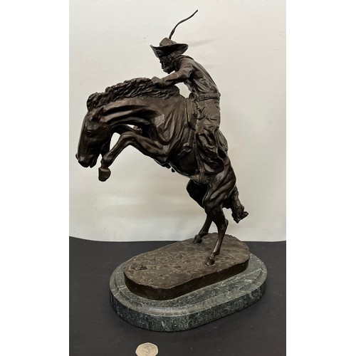 69 - C20th American Remington Cowboy sculpture in bronze. A study after Frederic Remington titled Bronco ... 