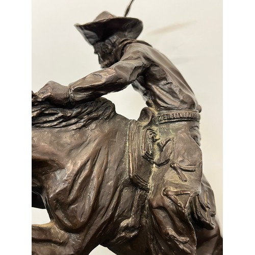 69 - C20th American Remington Cowboy sculpture in bronze. A study after Frederic Remington titled Bronco ... 