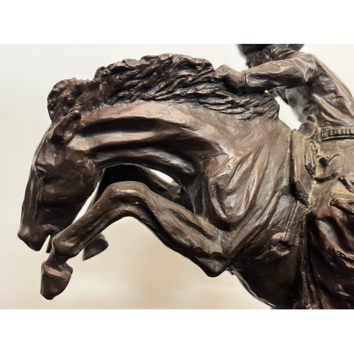 69 - C20th American Remington Cowboy sculpture in bronze. A study after Frederic Remington titled Bronco ... 