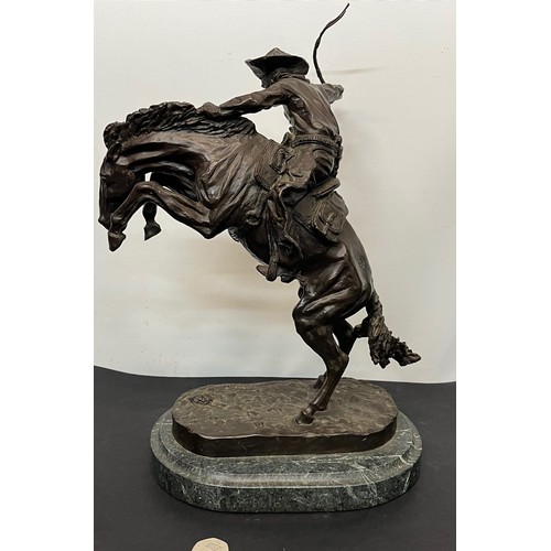 69 - C20th American Remington Cowboy sculpture in bronze. A study after Frederic Remington titled Bronco ... 