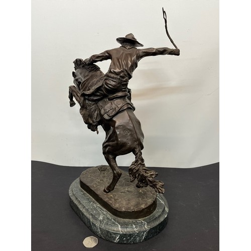 69 - C20th American Remington Cowboy sculpture in bronze. A study after Frederic Remington titled Bronco ... 