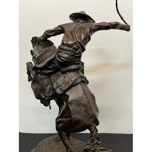 69 - C20th American Remington Cowboy sculpture in bronze. A study after Frederic Remington titled Bronco ... 