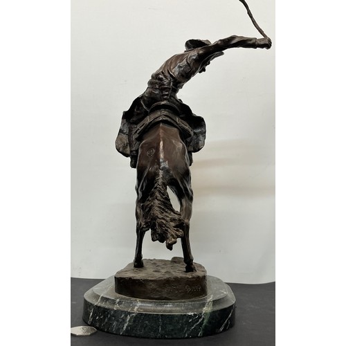 69 - C20th American Remington Cowboy sculpture in bronze. A study after Frederic Remington titled Bronco ... 