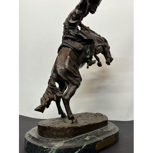 69 - C20th American Remington Cowboy sculpture in bronze. A study after Frederic Remington titled Bronco ... 