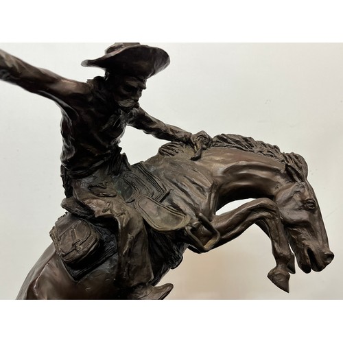 69 - C20th American Remington Cowboy sculpture in bronze. A study after Frederic Remington titled Bronco ... 