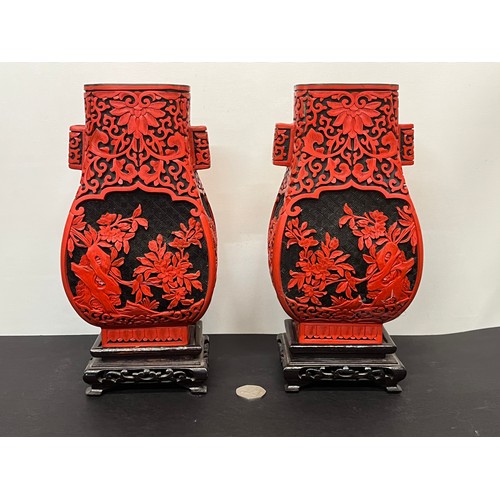 15 - Pair of Chinese red lacquer vases on stands.

This lot is available for in-house shipping