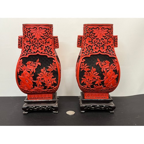 15 - Pair of Chinese red lacquer vases on stands.

This lot is available for in-house shipping