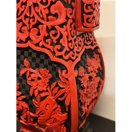 15 - Pair of Chinese red lacquer vases on stands.

This lot is available for in-house shipping