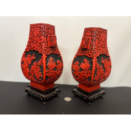 15 - Pair of Chinese red lacquer vases on stands.

This lot is available for in-house shipping