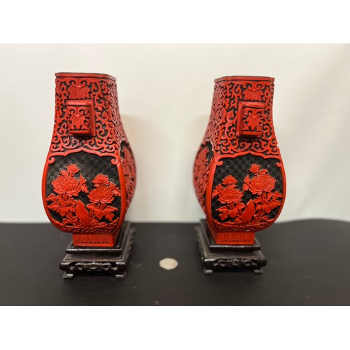 15 - Pair of Chinese red lacquer vases on stands.

This lot is available for in-house shipping